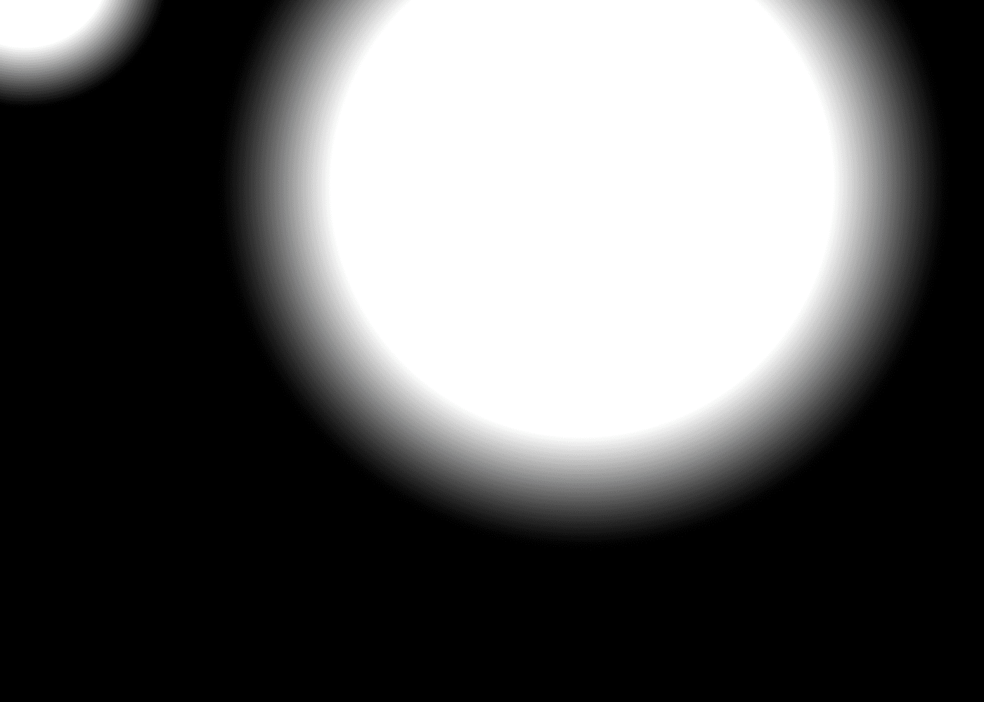 Soft, out-of-focus light on black. Deliberately unrecognisable.